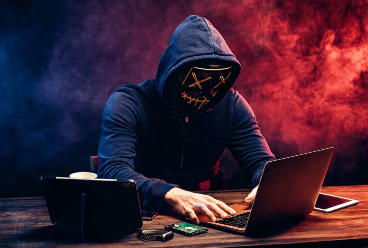 hacker man typing on laptop