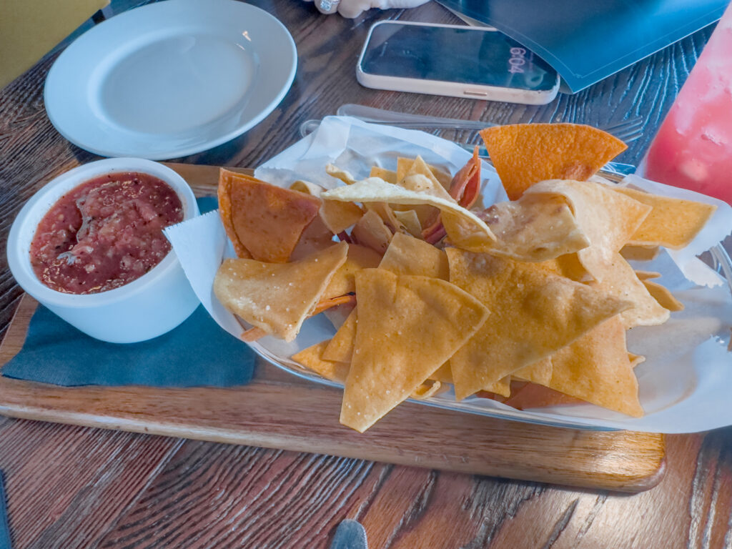 Kolucan Mexican Bar & Grill - Housemade tortilla chips and smoky salsa asada on a wooden board at Kolucan in Sarasota